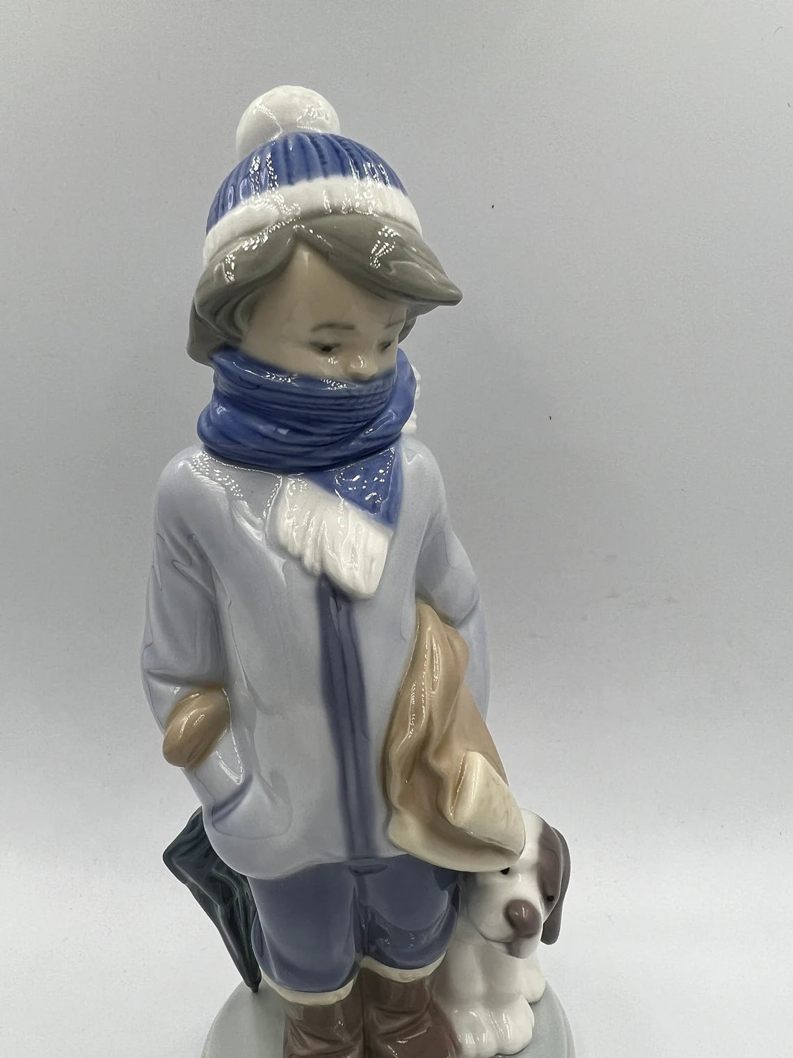 Lladro figurine 5220 - Retired - Winter Boy with scarf, umbrella and Dog - Royaltreasuryhouse